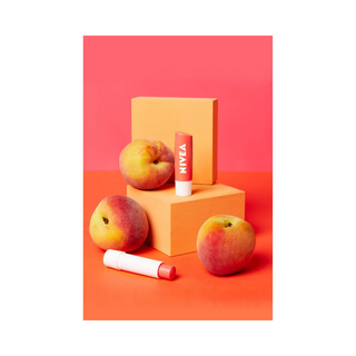 Nivea Peach Flavored Lip Balm and Gloss 24 Hour Moisturizing, Nourishing 4.8 gr - By Baano