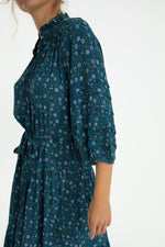 Close-up of Zoey Jo Belted Tiered Maxi Dress highlighting ruched sleeves, floral print, and belted waist design.
