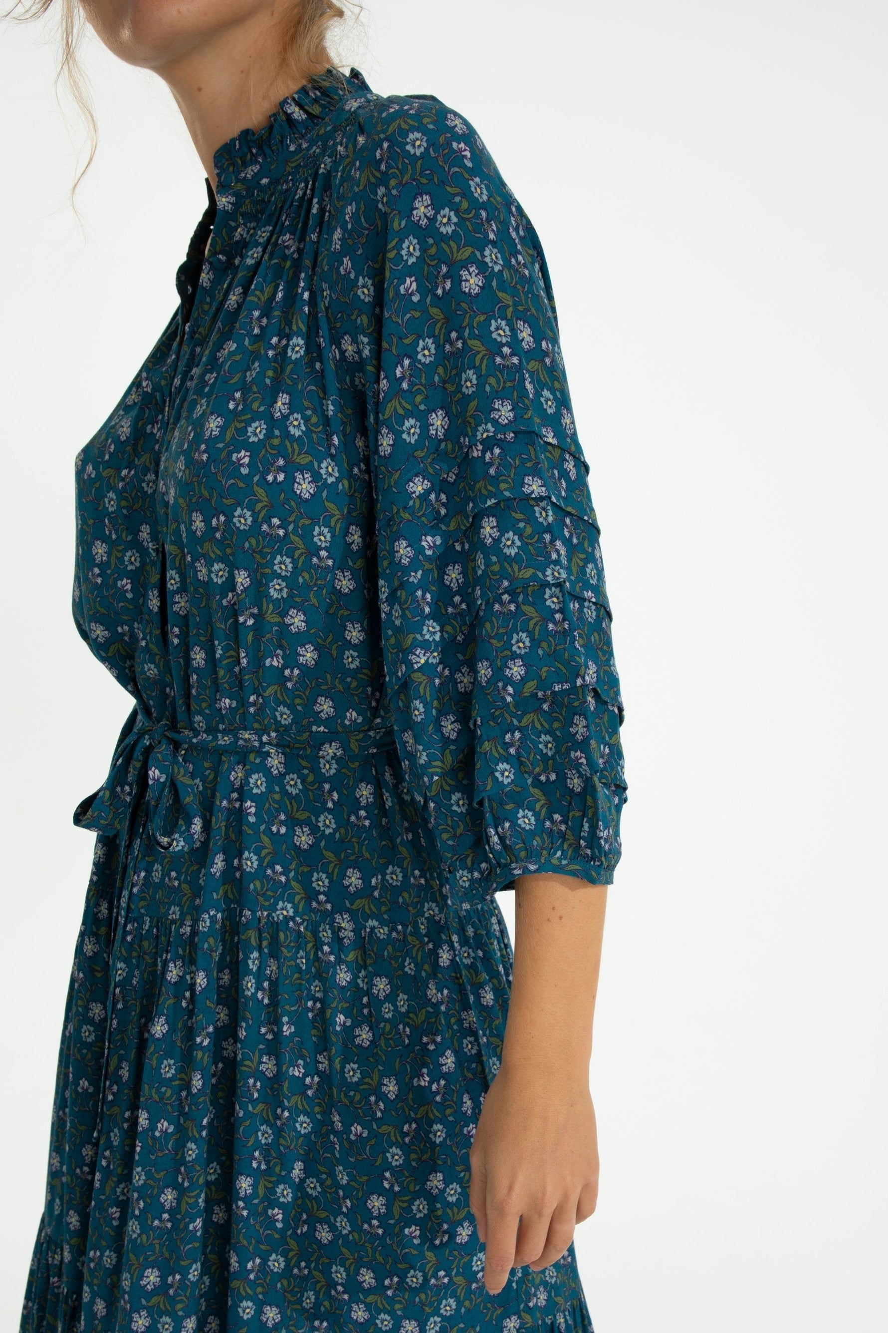 Close-up of Zoey Jo Belted Tiered Maxi Dress highlighting ruched sleeves, floral print, and belted waist design.