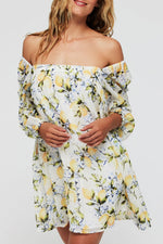 Lina Long Sleeve Cover Up Mini Dress in Lemons styled off-the-shoulder with a relaxed fit and citrus floral pattern, great for resort or poolside wear.