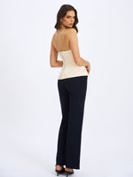 Yani Ivory Asymmetrical Lapel Sleeveless Peplum Top Miss Circle
