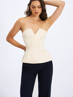 Yani Ivory Asymmetrical Lapel Sleeveless Peplum Top Miss Circle