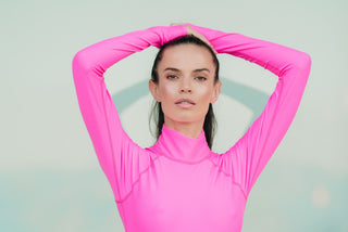 Women's UPF 50+ Sun Protective Long Sleeve "Shorty" Swimsuit - Neon Pink