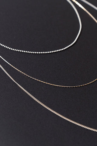 3 CHAIN LAYERD CHARM NECKLACE - By Baano