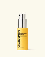 Superactive Serum by Gleamin in a yellow bottle with chrome pump, Vitamin C serum for dark spots and skin firming, 1 fl oz skincare product.