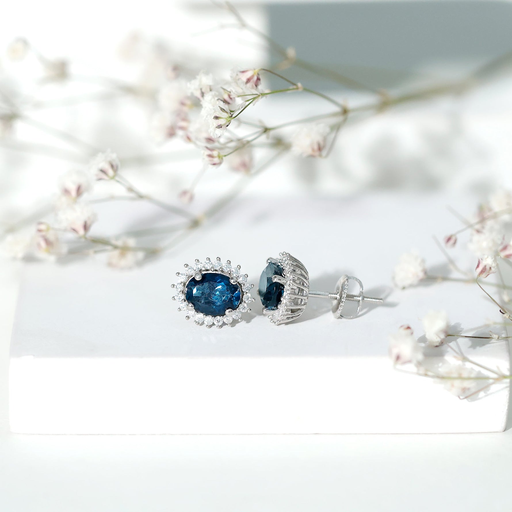 6X8MM Oval London Blue Topaz Stud Earrings with Moissanite Halo