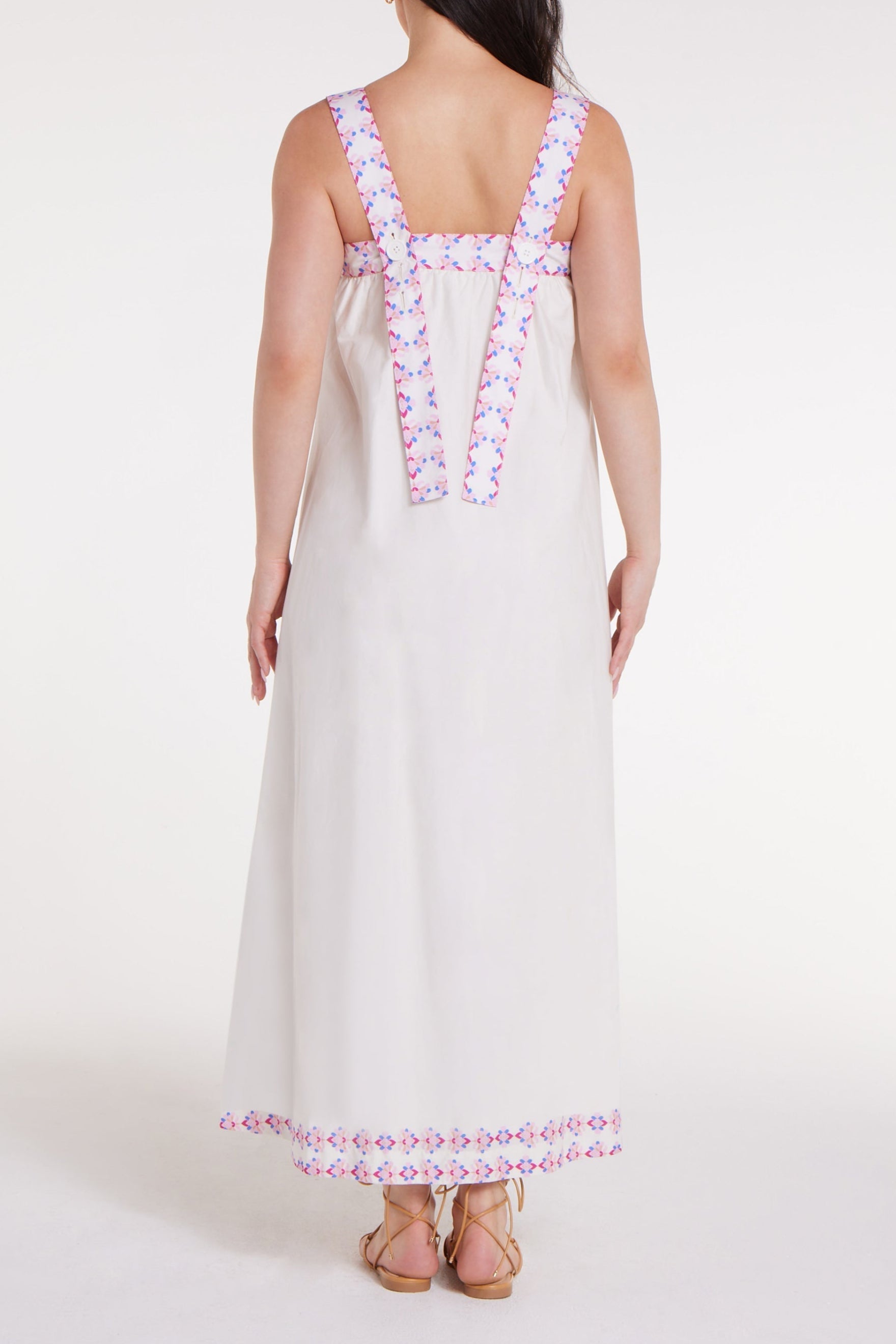 Back view of Ava Maxi Dress in Graceful Garlands showing wide floral straps and flowing silhouette, perfect for casual elegance.