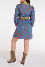 Back view of Halle Collared Belted Mini Dress in Blue Floral showing gathered waist and floral pattern with yellow belt detail.