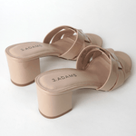 Back view of J.Adams Nori Beige Patent Sandals highlighting the sturdy block heels and sleek patent finish for modern fashion looks.