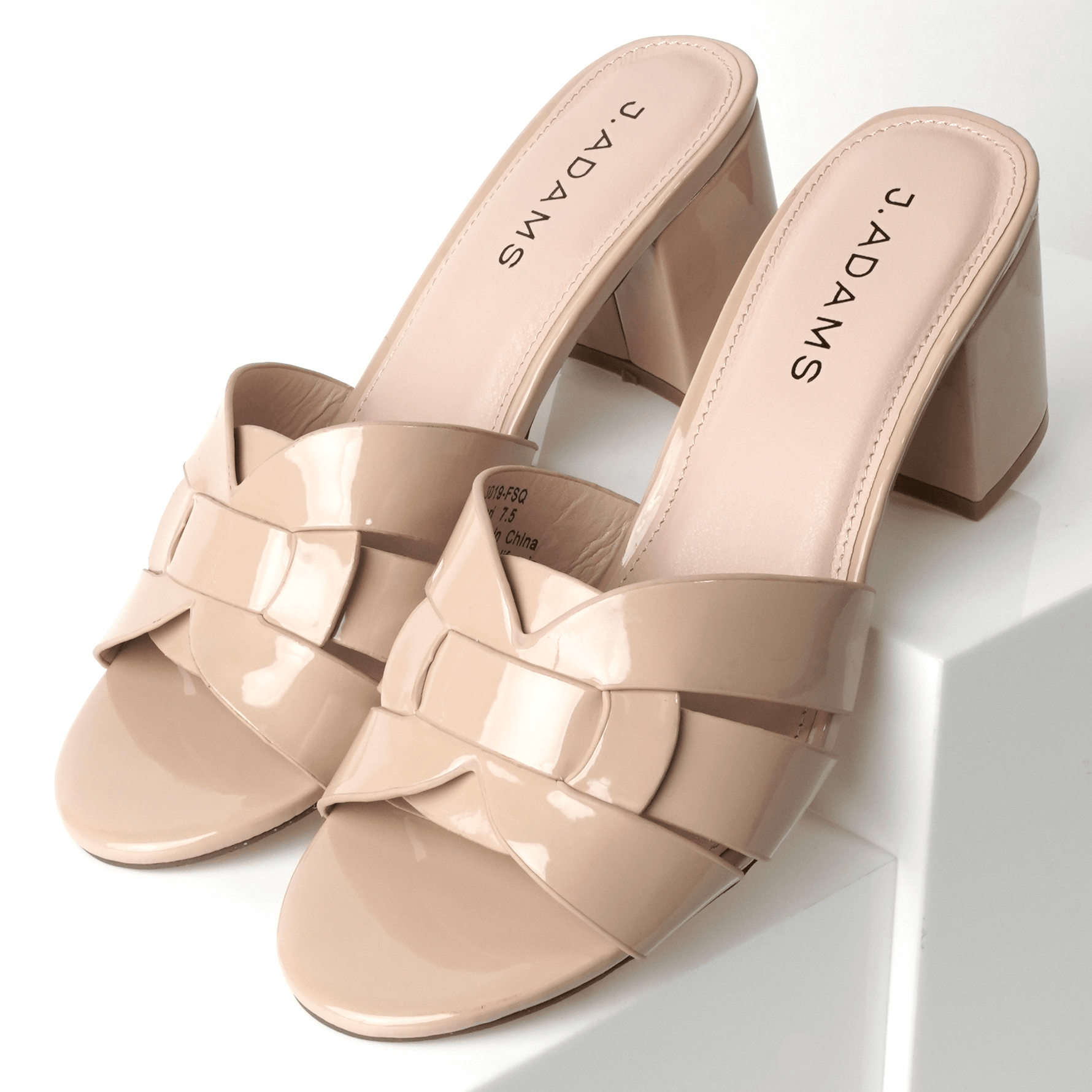 Angled view of Nori Beige Patent Sandals with chunky heels and wide glossy straps, ideal for versatile styling in footwear collections.