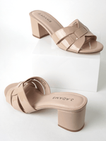 Flat lay of Nori Beige Patent Sandals with geometric straps and chunky heels, combining comfort and style for everyday wear.