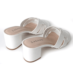 Back view of Nori | White Sandals highlighting the sturdy block heel and smooth finish, designed for all-day wear.