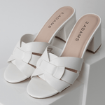 Angled view of Nori | White Sandals with mid-height block heel and elegant woven straps, ideal for versatile styling.