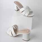 Pair of Nori | White Sandals displayed on a white platform, showcasing their modern silhouette and clean design.